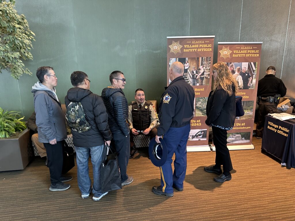 Village public safety officers meeting with group
